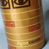 rund guldfarvet cacao dåse svensk design med store øjne retro metaldåse